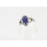 A continental 14ct gold tanzanite and diamond dress ring, the pear cut tanzanite in four claw