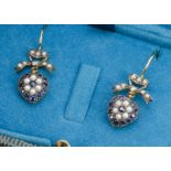 A pair of sapphire, diamond and seed pearl earrings, of heart drops, with bow tops on gold loops,