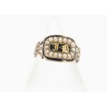 A 19th Century mourning ring, the enamel and seed pearl setting with gothic initials JB, on a