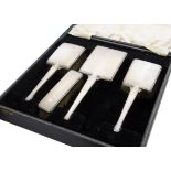 A 1960s part cased silver dressing table set, square black leatherette case with hand mirror, pair