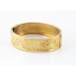 A Victorian silver gilt aesthetic decoration bangle, with engraved swallows and foliage,