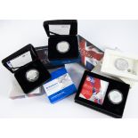 Seven modern Britannia one ounce silver coins, all uncirculated and in Royal Mint boxes