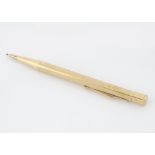 A c1940s Yard-O-Led 9ct gold propelling pencil, engine turned body, engarved H.D. Ward, 20g
