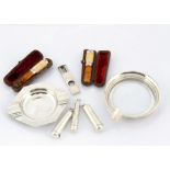 Eight smoking related silver and silver plated collectables, including a silver cheroot case with