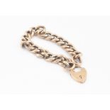 A 9ct gold curb linked padlock clasp bracelet, 21g,