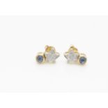 A pair of contemporary 18ct yellow gold diamond and sapphire ear studs, the diamond set stars set