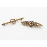 A 9ct gold heart bar brooch, the twist bar with openwork heart to centre, Birmingham 1949,