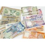 A small collection of world bank notes, with examples from Sri Lanka, Zambia, Ghana, and more (