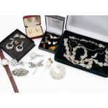 A collection of costume jewellery, including a pair of shell cameo stud earrings, various paste