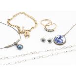 A small quantity of silver and gold jewels, including a flattened curb linked bracelet with