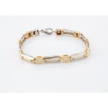 A gentleman's 14ct two colour gold diamond bracelet, the white metal batons alternately set with