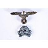 An SS Waffen Skull and Eagle, the eagle stamped RZM, SS and 900, the skull no markings (2)