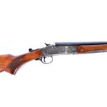 A Spanish 12 bore single shot gun, serial 57301, having wild boar and hunting dogs engraved design