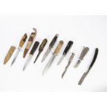 An assortment of blades, including a Solingen cut throat razor, a William Rodgers hunting knife,