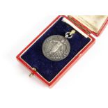 A hallmarked silver Motor Cycling Club medal, dated Birmingham 1925-26, by Mappin & Webb Ltd, for