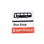 A Hants & Dorset enamel Bus Stop sign, being double sided, image of a bus above text, with