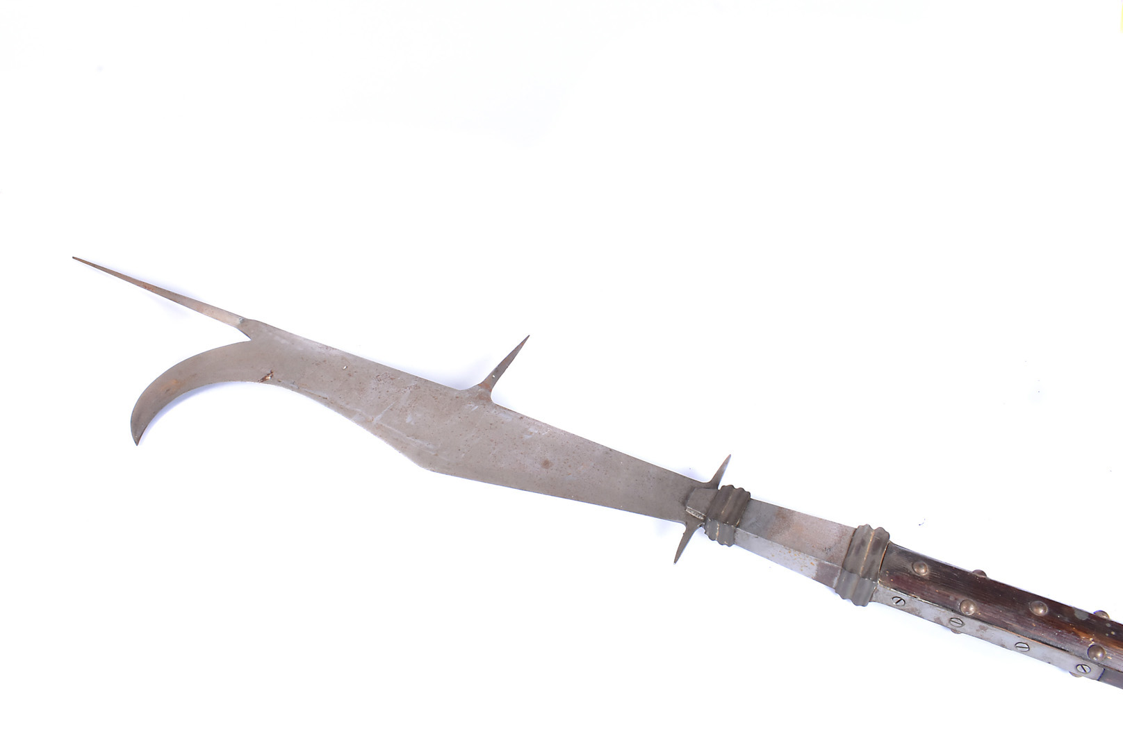 A Medieval style Bill Hook, having studded wooden pole, leading to shaped metal bill, with large