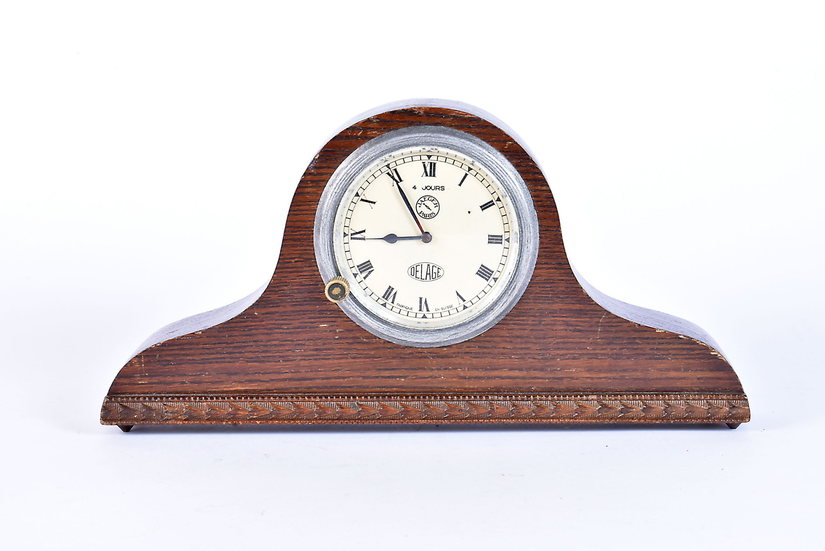 A Delage Jaeger dashboard clock, having black Roman numerals on cream dial, 4 hour movement, mounted