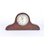 A Delage Jaeger dashboard clock, having black Roman numerals on cream dial, 4 hour movement, mounted