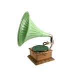 A horn gramophone, with oak case, machine carved mouldings, Heart soundbox on gooseneck tone-arm and