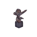 A bronze Spirit of Ecstasy, the kneeling lad mounted on small wooden plinth, 11.5cm tall