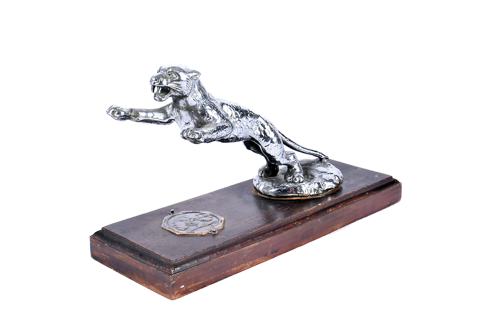 A Desmo leaping Jaguar mascot, mounted to wooden base, having white metal St Christopher plaque to