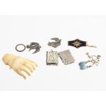 A collection of miscellaneous 19th Century jewels, including a bone carved hand, a pair of turquoise