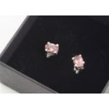 A pair of pink tourmaline mixed oval cut ear studs, in silver claw settings, boxed