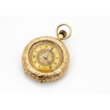 A late Victorian 15ct gold lady~s pocket watch, engraved to rear cover and thick bezel, gilt dial,