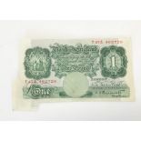 An error British one pound note, having an oversized corner that was folded after printing, from