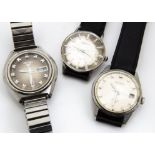 A c1970s Seiko 5 automatic stainless steel gentleman~s wristwatch, on later strap, together with two