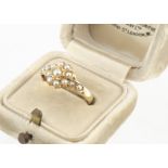 A Victorian 18ct gold seed pearl cluster ring, with half cut pearls on a yellow gold shank,