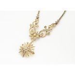 An Edwardian 15ct marked gold and seed pearl necklace, with detachable star drop pendant or