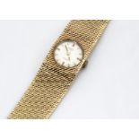 A c1970s 9ct gold Rotary lady~s wristwatch, circular dial in an integrated mesh link 9ct gold