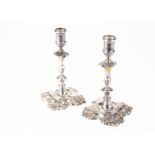 A pair of interesting 19th Century Irish silver candlesticks from ID, in the Georgian taste, 29.5