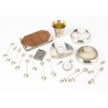 A group of collectable silver and white metal items, including a crocodile skin and silver purse,