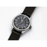 A Timor stainless steel military issue wristwatch, similar to a Dirty Dozen example, 36mm case,