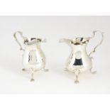 Two George III period silver milk jugs, both similar on three supports, one repaired, 4.5 ozt and