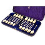 A cased set of 18 Victorian silver Apostle teaspoons Frederick Elkington, also with a pair of tongs,