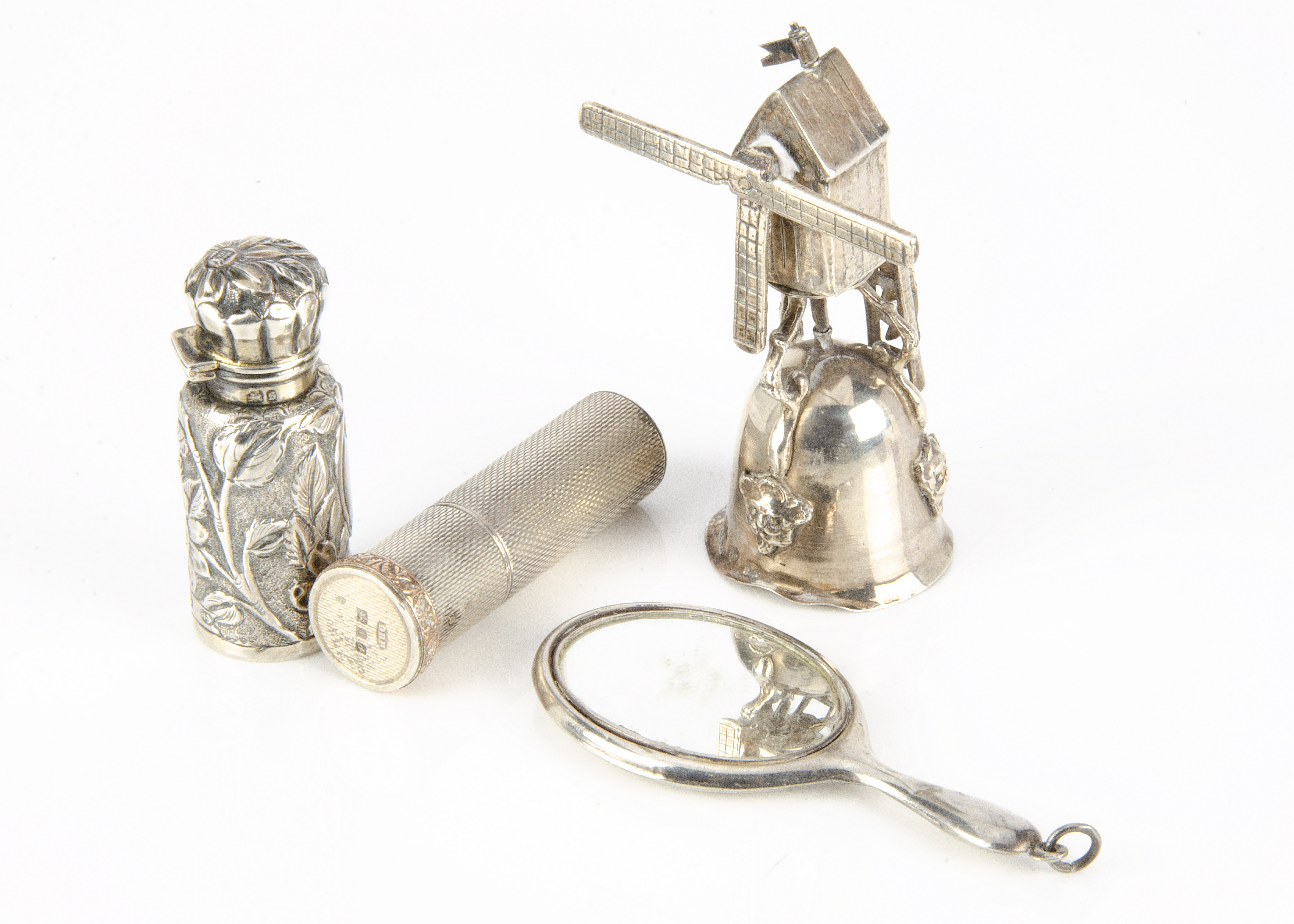 Four early to mid 20th Century collectable silver items, including a Dutch windmill cup, AF, a