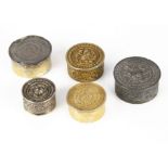 A set of three small Indian silver circular boxes, the largest 5cm diameter, dented, the other two