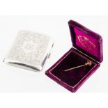 A 9ct gold ruby stick pin, 1.3g, 5.6cm, in purple case together with a George V silver cigarette