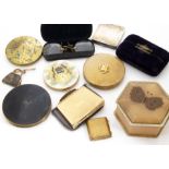 A small collection of lady~s compacts, including one with a painted top depicting Pekinese signed