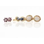 A pair of 18ct gold sapphire and diamond stud cluster earrings, the oval mixed cut sapphire