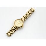 A 1990s Accurist 9ct gold lady~s wristwatch, circular case with integrated 9ct gold bracelet, 18.8g