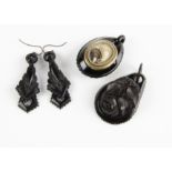 A pair of Victorian jet earrings, of tapered articulated design, with loop backs, 6.5cm drop