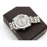 A c1970s Timex stainless steel gentleman~s wristwatch, 35mm tonneau case with checker effect and