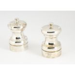 A pair of 1980s silver salt and pepper mills by MCH, London 1988