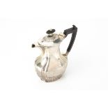 An Edwardian silver hot water jug, Sheffield 1905, 11.9 ozt, retailed through Wyatt in Bournemouth