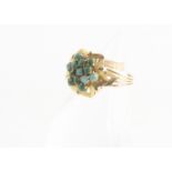 A continental yellow metal turquoise set cluster ring, the turquoise clusters in an ornate leaf